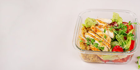 Healthy lunchbox with grilled chicken, lentils, fresh vegetable salad. Bannerの写真素材