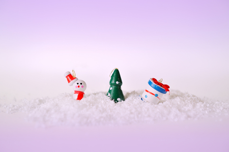 toy snowman tree and gift on snowの写真素材