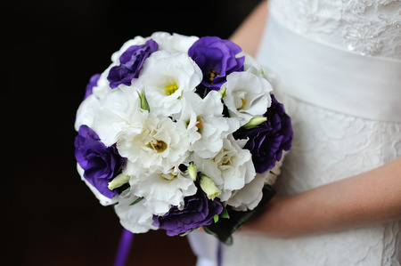 wedding bouquet of purple and white flowersの写真素材