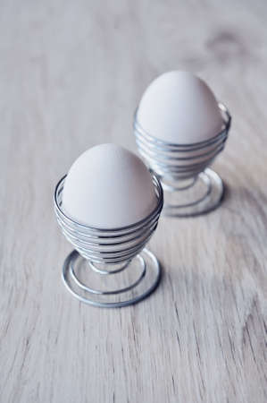 Two easter eggs on white background tableの写真素材