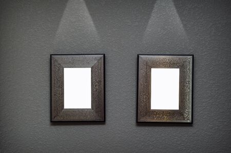 two metal frame on the wall with lighting