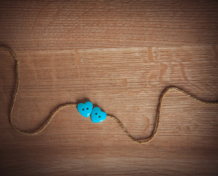 two hearts on a wooden background