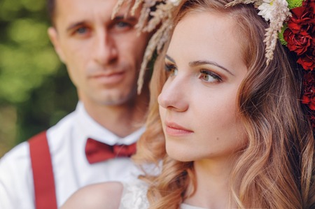 Happy bride and groom walking in spring day.の写真素材