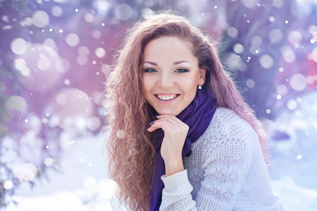 portrait of a beautiful happy woman in winter.の写真素材