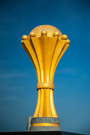 golden championship trophy on a blue backgroundの写真素材