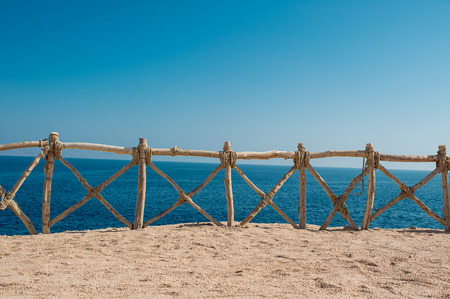 Sea views, protective wooden fence.の写真素材
