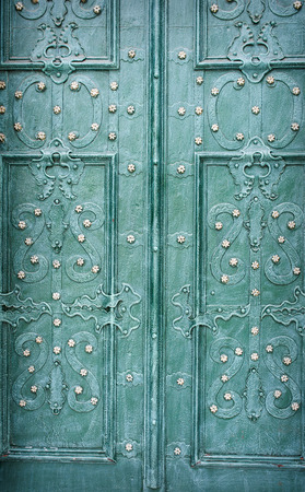 metallic background of green color on old door.の写真素材