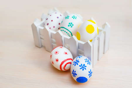 easter eggs in a paper holiday bag, Easter eggs on wooden background.の写真素材