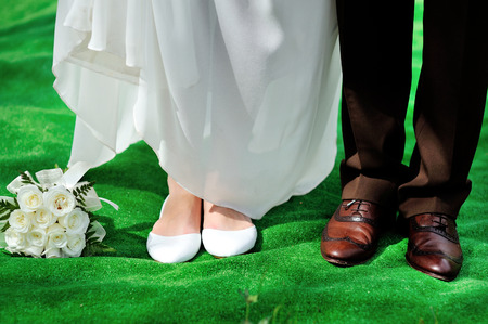 shoes the bride and groom with wedding bouquet, newlyweds are ready for the ceremony.の写真素材