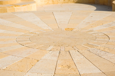 stone texture, sand-colored background.