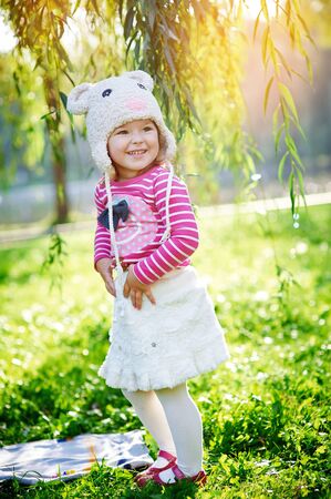 little girl walks in the summer parkの写真素材