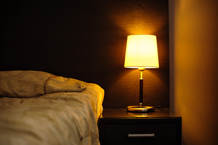 reading lamps in the bedroom near the bed.の写真素材
