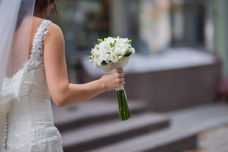 Bride holding a beautiful wedding bouquet.の写真素材