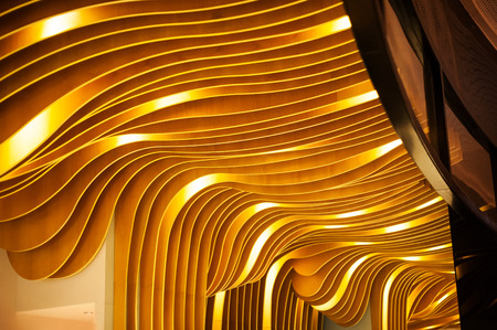 Beautiful decor wavy golden ceiling indoor.の写真素材