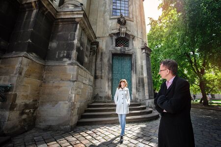 man with a woman walking in the city.の写真素材