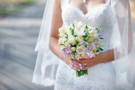 bride holding a wedding bouquet.の写真素材