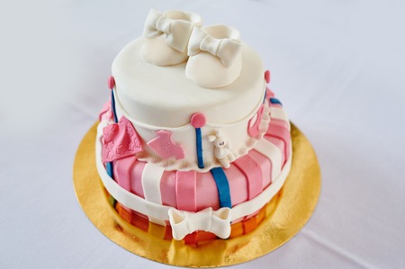 beautiful two-layer pink and white birthday cake.の写真素材