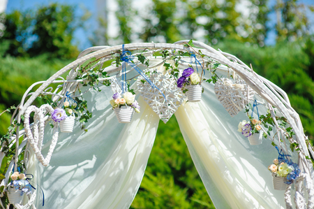 Wedding archway with flowers arranged in park  for a wedding ceremonyの写真素材
