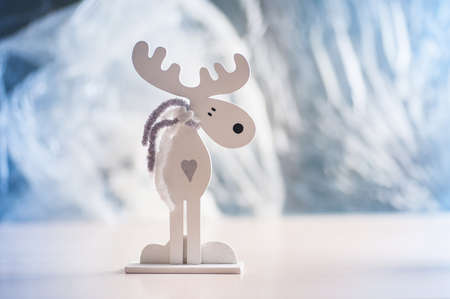 white wooden moose on a light background. Christmas decorations.の写真素材