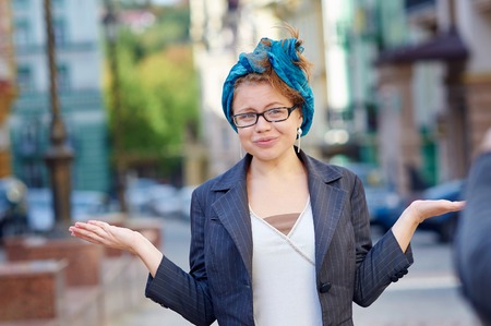 emotional woman in glasses walking in the city.の写真素材