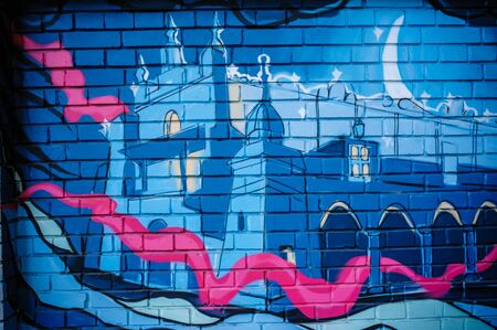 Beautiful street art graffiti. castle drawing blue colors on the walls of the building. Urban Contemporary Cultureのeditorial素材