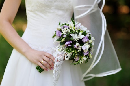 beautiful wedding bouquet at bride's handsの写真素材