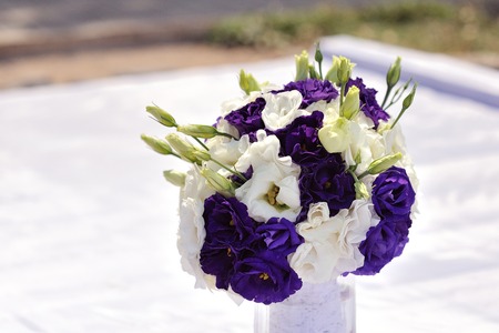 Bouquet of white and violet flowers on a white backgroundの写真素材