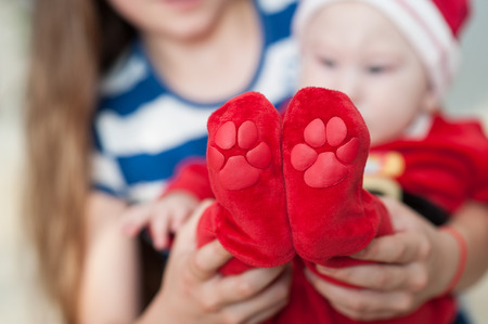 Baby feet in mother hands. Beautiful conceptual image of Maternity.の写真素材