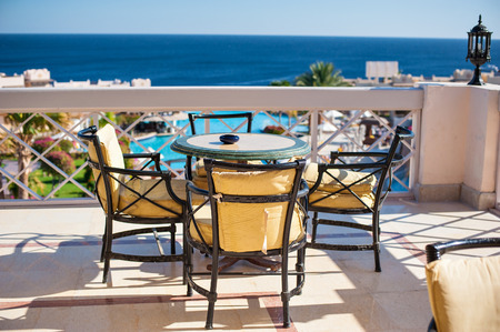 table on a summer area overlooking the sea.の写真素材
