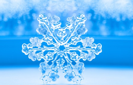 beautiful big snowflake on a blue background.
