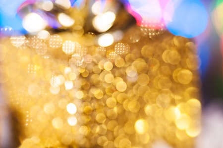 Christmas gift box on golden background.の写真素材