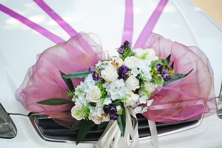 decorated with a beautiful bouquet on wedding car.の写真素材