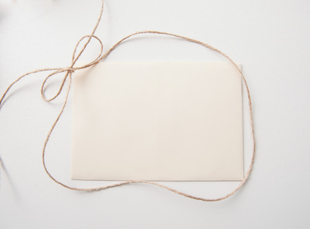 sheet of paper with bow and place for text. Greating card.