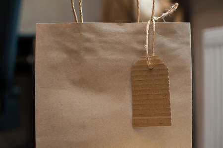 Brown craft paper bag for gift and paper tag.の写真素材