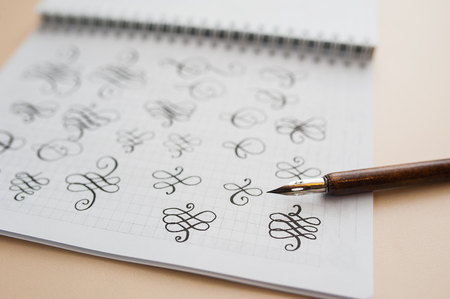 abstract calligraphic figures hand drawing pointed stylus.の写真素材