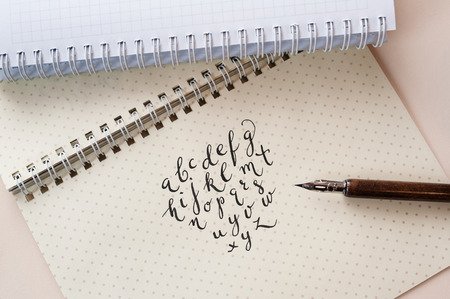 Hand drawn calligraphic English alphabet written with ink pen.の写真素材