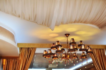 beautiful crystal chandelier in luxury interior of hotelの写真素材