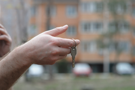 Man hand holding house key concept work.の写真素材