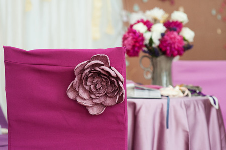Decor on red chair Marsala with handmade flower for wedding ceremony.の写真素材