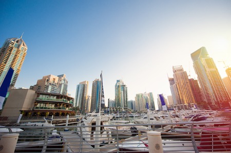 Dubai, UAE - November 30, 2013: Skyscrapers in the setting sun in Dubai Marina.のeditorial素材