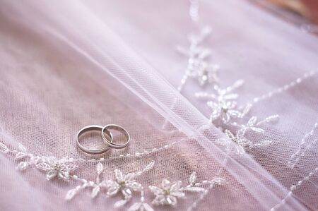 gold rings bride and groom on the veil.の写真素材