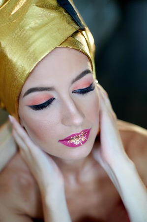 beautiful young woman with makeup in the Egyptian style.