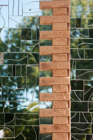 mirror wall of the building with brick inlays.の写真素材