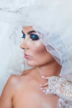 Portrait of bride with a veil and makeup.の写真素材