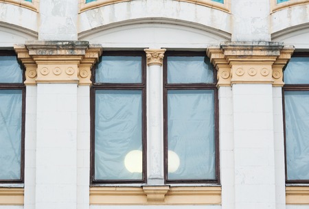 white columns on the facade of the building in classical style.