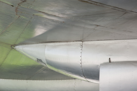 Aluminum fuselage and rivets on old airplane.