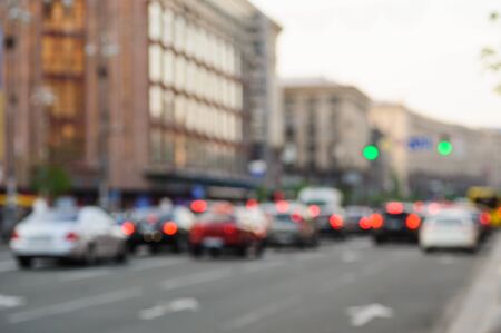 cars in big city on road with blurred focus.の写真素材