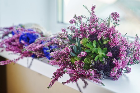 beautiful bridal bouquet on the windowsillの写真素材