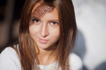 Portrait of a beautiful young woman with make-upの写真素材