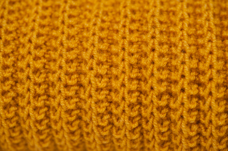 knitted fabric texture orangeの写真素材